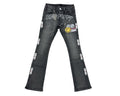 Black jeans with various patches and designs on a white background