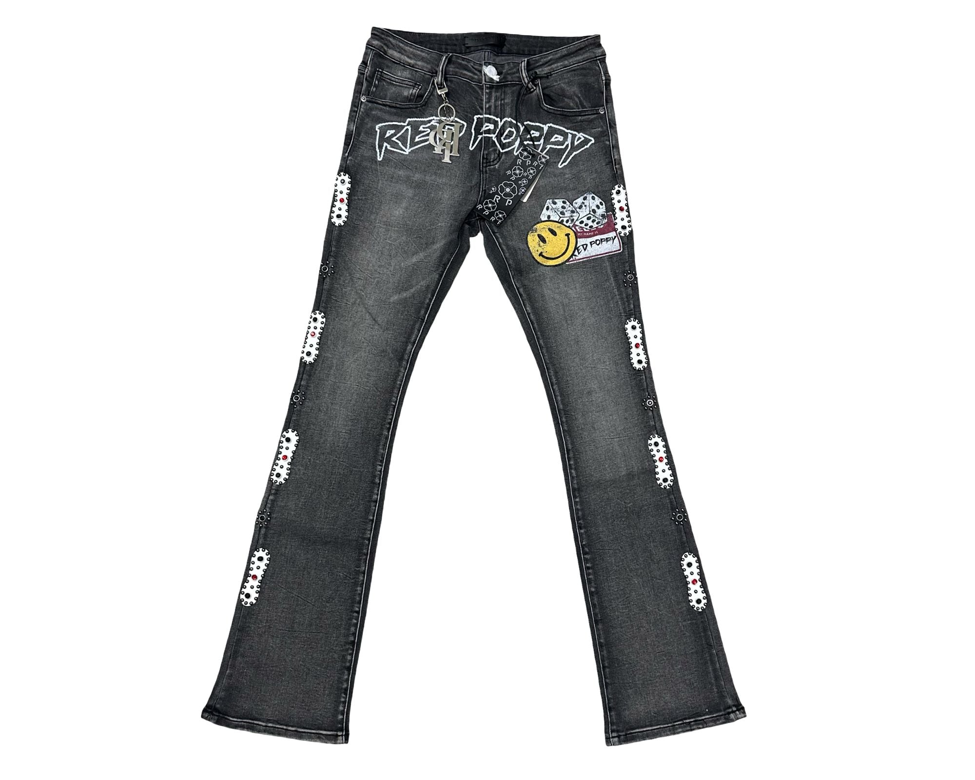 Black jeans with various patches and designs on a white background